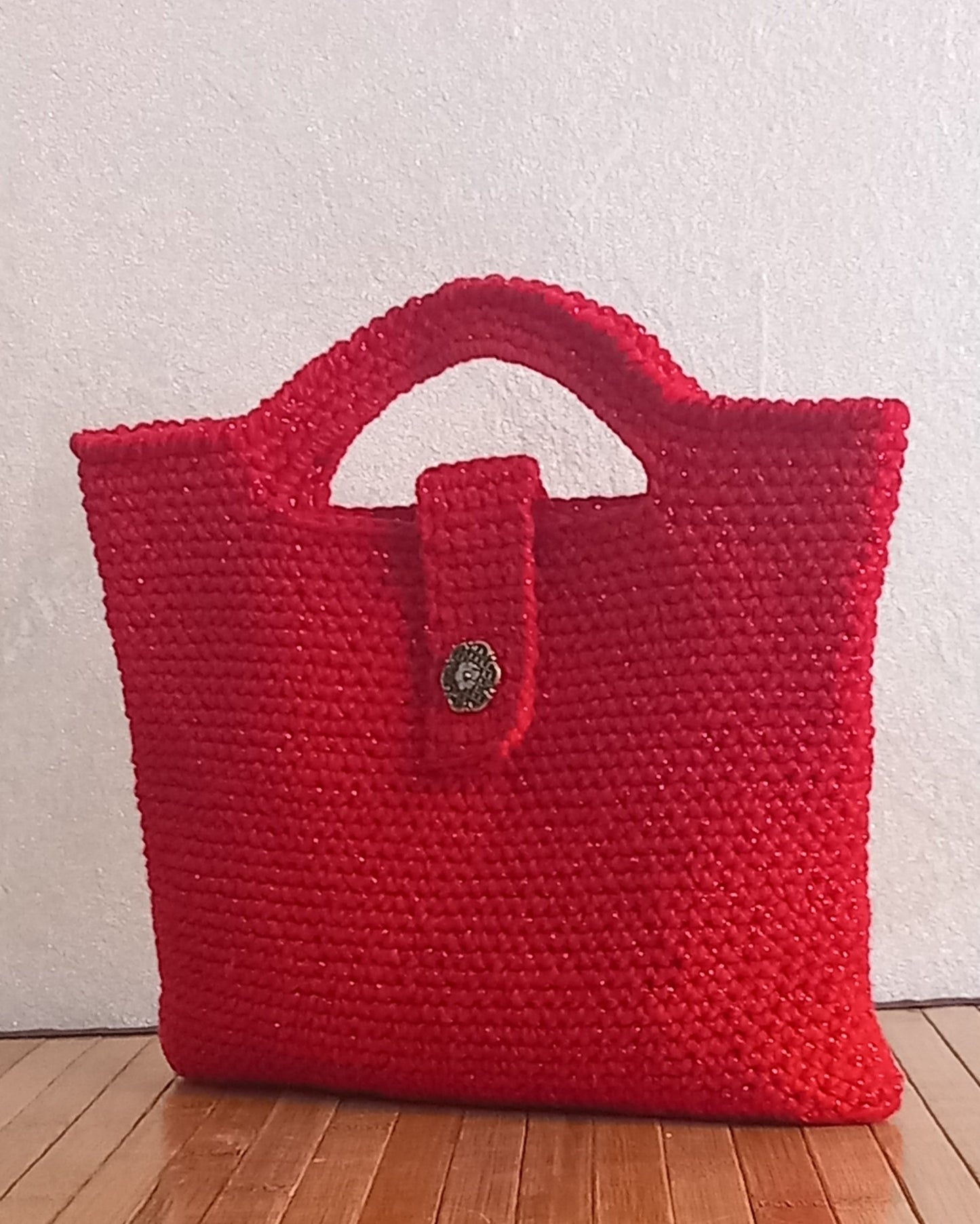 borsa artigianale mini bag stella in cotone e lamè lavorata all'uncinetto con elegante chiusura con un bottone floreale